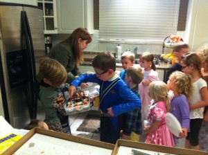 Joshua handing out his baking